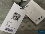a qr code on the tag of a sweater