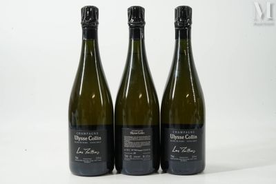 trois bouteilles de vin posées l'une à côté de l'autre sur une table
