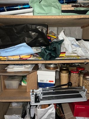 a shelf with many items on it in a room