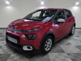 the red citrole is parked on a checkered floor