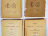 four books on a white table with a white background