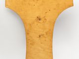 an old wooden object on a white surface with a white background