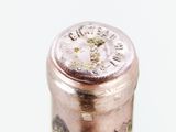 a close up of a bottle of wine on a table