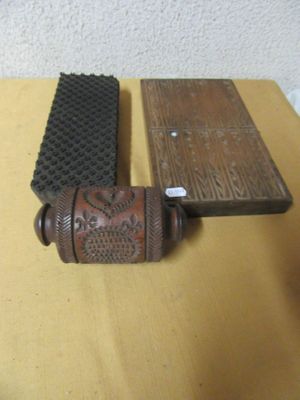 two wooden items on a table next to each other