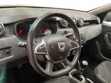 dashboard of a car with a steering wheel and dashboard controls