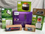 several boxes of philips appliances are sitting on a white surface