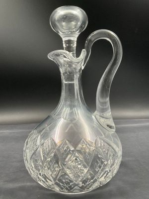an image of a clear glass decanter on a table