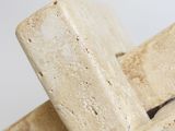 beige marble cross on a white background