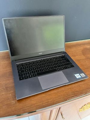 a laptop computer sitting on a desk with a cup of coffee