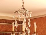 a chandelier hanging from the ceiling in a room