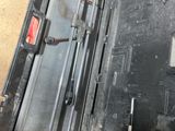 a black case with a metal latch inside of it