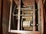 a clock that is sitting inside of a wooden box