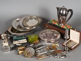 a lot of silverware and silverware on a table
