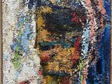 une peinture à l'huile représentant le visage d'une femme, dans un cadre en bois