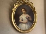 a picture of a woman in a white dress hanging on a wall