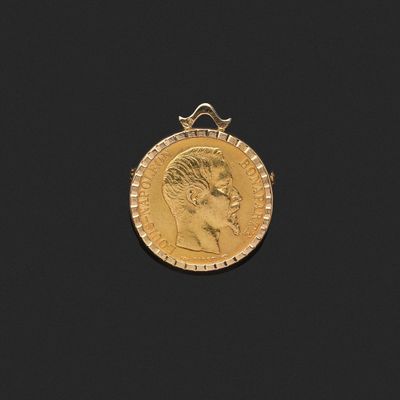 gros plan d'une pièce d'or sur laquelle figure le visage d'un homme