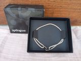 the box is open to show a necklace and a bracelet