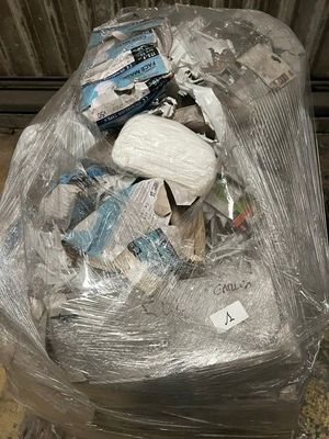 a plastic bag full of items sitting on the floor