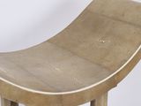 a wooden stool with a curved seat on a white background