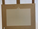 a wooden easel with a painting on top of it on a white background