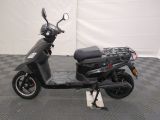 a scooter that is parked on a checkered floor