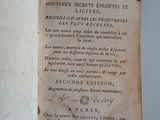 an open book with writing on it sitting on a table