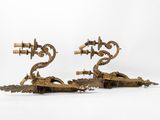 pair of antique brass candlesticks on a white background