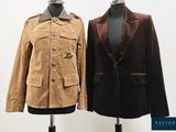 two jackets on a mannequin stand on a white background