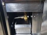 a metal sink with a metal faucet in it