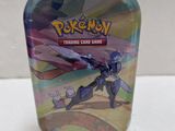 pokemon trading card game tin with a picture of a pokemon character