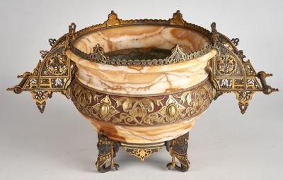 a large ornate vase that is sitting on a stand