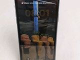 a phone that is sitting on a stand on a table