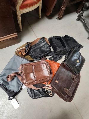 a lot of bags that are sitting on the floor
