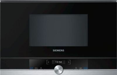 un gros plan d'un micro-ondes dont la porte est ouverte