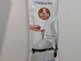 a bag that is hanging on a refrigerator door