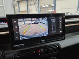 a view of a car ' s rear view mirror from inside the vehicle