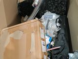 a cardboard box full of items in a room
