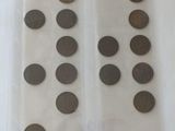 some coins are in a clear plastic bag on a table