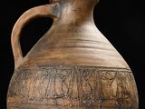 a large brown vase that is sitting on a table