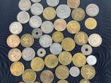 a lot of coins that are on the table