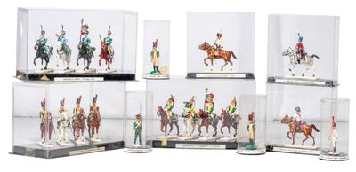 six miniature figurines of soldiers riding on horses in glass cases
