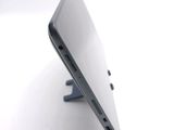 a close up of a laptop computer on a stand
