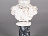 marble bust of a man on a pedestal on a gray background