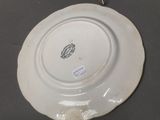 a white plate with a black and white design on it