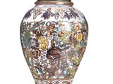 a vase that is sitting on a white surface