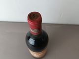 a bottle of wine that is sitting on a table