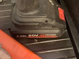 a cordless drill that is sitting on the floor