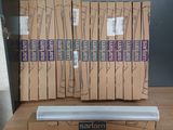 a lot of boxes of cigarettes sitting on a table