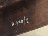a close up view of a piece of wood with writing on it