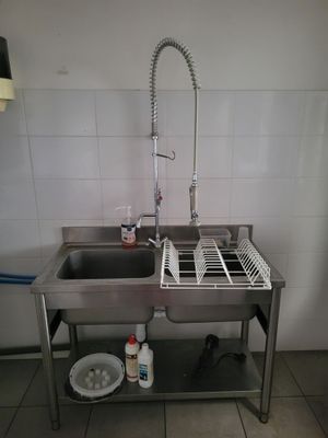a sink and a dish rack in a kitchen